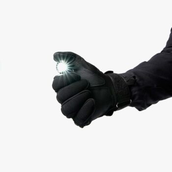 Black tactical angle flashlight activated in gloved hand