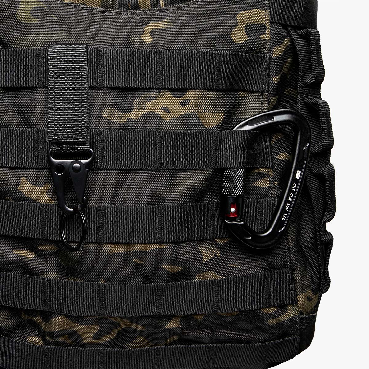 tactical back with molle system SAINT tactical backpack with MOLLE webbing system, black carabiner attachment, and heavy-duty hook clasp on durable 900D Oxford camouflage fabric